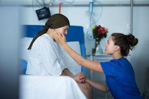Empathic nurse taking care of senior woman